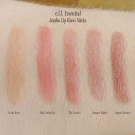 Swatches of the e.l.f. Essential Jumbo Lip Gloss Sticks in Sangria Starters, Summer Nights, Tiki Torches, Pink Umbrellas, and In the Nude.