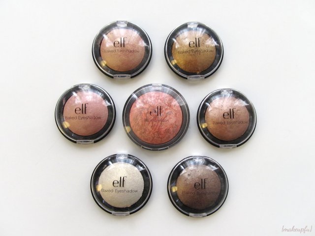 Size comparison between the e.l.f. Studio Baked Eyeshadow and Baked Blush. Starting with the top left and working clockwise: Enchanted, Bronzed Beauty, Toasted, Bark, Moonlight Serenade, and Pixie around the blush Peachy Cheeky.
