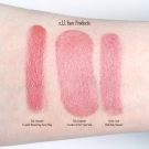 Swatches of the e.l.f. Essential Shimmering Facial Whip & All Over Color Stick in Pink Lemonade, and the Studio Body Shimmer in Cosmic Coral