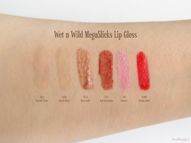 Swatches of Wet n Wild MegaSlicks Lip Gloss: 561A Crystal Clear, 560A Sweet Glaze, 576A Rose Gold, 577A Red Sensation, 578 Sinless, and 34480 Bloody Good